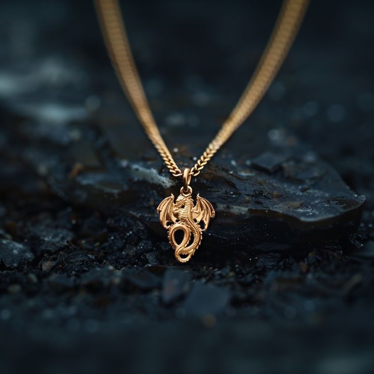 PENDANT INFORMATION This pendant is made of real, solid gold.• Made in USA• Size: Mini• Material: 14k or 18k solid gold• Finish: polished• Height: 1" (26 mm) | *includes the small circle, bail dimensions not included• Width: 0.8" (20,5 mm)• Pendant weight (approx.): 3 grams (14k)• Bail: fits up to 4 mm chains• Solid back, not hollow• A certificate of authenticity is included• Delivered in our elegant jewelry box, making it the perfect giftPlease note: Our Mini sized pendants are small and delica April Crafts, Mini Dragon, Symbol Of Strength, Gold Dragon, Dragon Necklace, Mythical Creature, Small Circle, Solid Gold Chains, Box Making