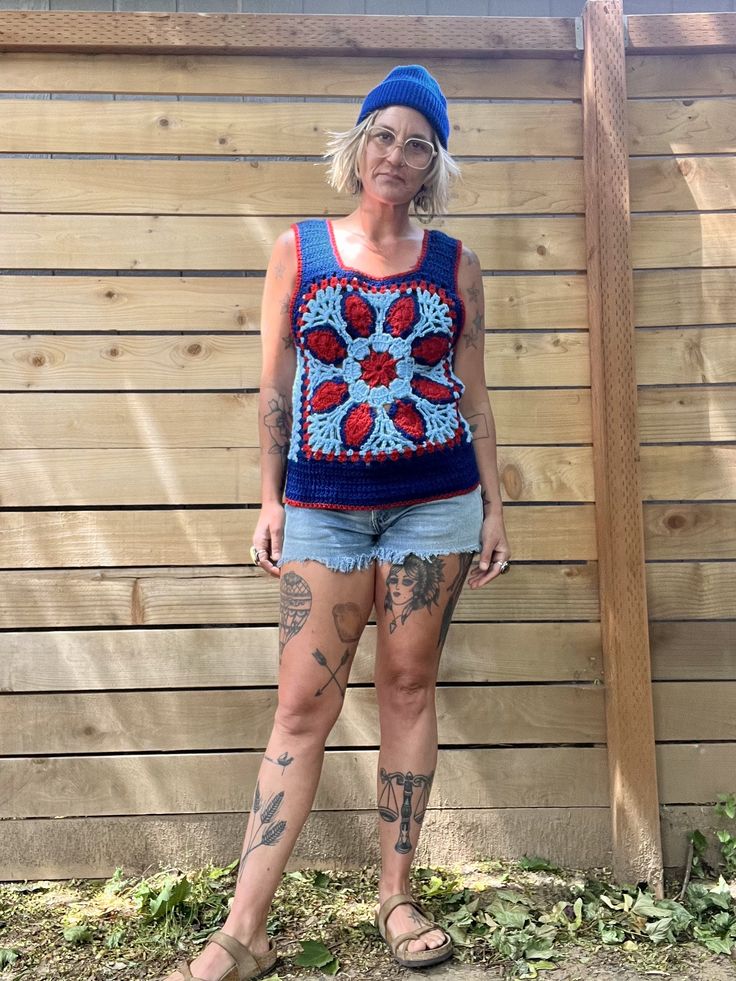 Holy crap this is amazing and special  1970's handmade crocheted tank top  Blue, light blue and red colors  Great pattern and design  Tank sleeves and scoop down pretty low so your bra will definitely hang out  That doesn't bother me but it may to some so it's to be noted  It's in amazing condition  Fits a medium/smaller large there is a little stretch to the yarn  Measurements are approximate and taken flat so please double bust and waist for more accurate sizing  Bust: 17.5 in  Waist: 16 in  L Blue Casual Tank Top For Festival, Casual Blue Tank Top For Festivals, Bohemian Cotton Crochet Tank Top, Bohemian Blue Tank Top For Beach, Handmade Blue Tops For Festival, Handmade Bohemian Blue Tops, Handmade Blue Bohemian Tops, Multicolor Crochet Sleeveless Tank Top, Bohemian Tank Crochet Top For Summer