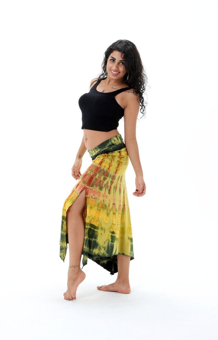 A Yellow Sarong wrap that is bursting with vivid tie dye colors. This comfy pareo wrap is the ideal beach and swim wear fashion that can be used for a variety of purposes. This handmade sarong is carefully crafted with the intricate combination of all natural dyes to create a unique feather tie dye pattern.  Perfect to use as a wrap on those hot days or just to show off your colorful side. A classic tie dye pattern which evokes a strong summer vibe. This skirt wrap is a beautiful tie dye item th Bohemian Multicolor Bottoms For Beach Party, Multicolor Bohemian Bottoms For Beach Party, Tie Dye Beachwear Bottoms For Beach, Bohemian Multicolor Bottoms For Beach Cover-up, Tie Dye Summer Beach Bottoms, Hippie Style Yellow Beach Bottoms, Yellow Hippie Beach Bottoms, Hippie Yellow Bottoms For The Beach, Hippie Yellow Beach Bottoms