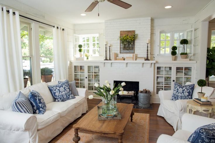 a living room filled with furniture and a fire place