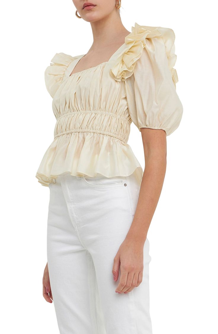 Shirring at the waist creates elegant shape on this puff-sleeve blouse crafted with frothy ruffles at the shoulders for dramatic flair. Square neck   Short sleeves   Lined   85% Tencel® lyocell, 15% polyester   Tencel lyocell is a sustainably produced fiber made with closed-loop processing   Hand wash, dry flat   Imported Chic Ruffled Peplum Blouse, Chic Peplum Ruffle Blouse, Chic Peplum Blouse With Ruffles, Chic Ruched Blouse With Square Neck, Chic Square Neck Ruched Blouse, Elegant Spring Smocked Top With Ruffles, Elegant Smocked Top With Ruffles For Spring, Elegant Smocked Ruffle Top For Spring, Elegant Summer Smocked Top