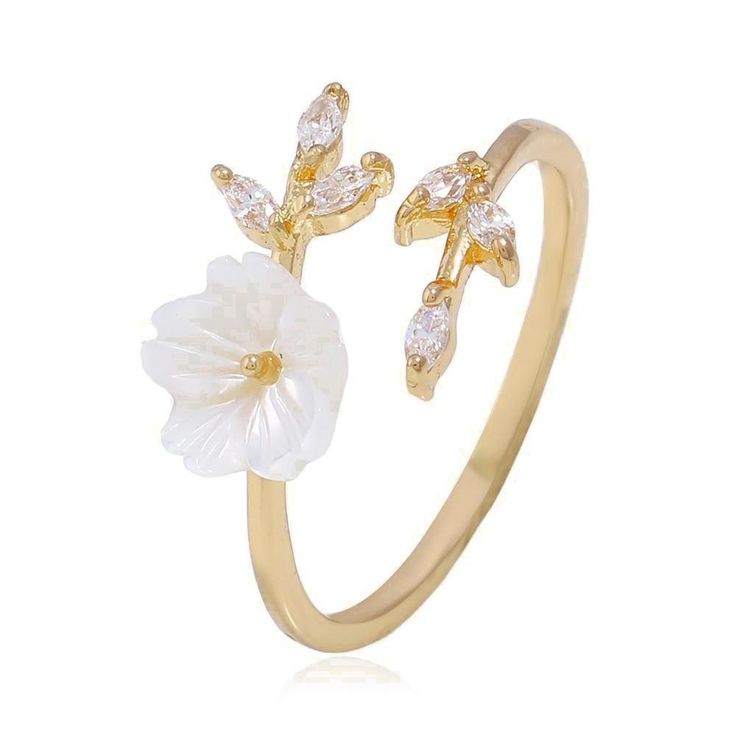 White flowers symbolize reverence and humility, purity and innocence or sympathy for a bereavement. Flaunt your whimsical charm in our Flower Branch Ring which shows off a sweet white flower motif and stunning CZ stones as "leaves". DETAILS & SIZE Composition: Gold, rose gold or silver plated over copper; 1-3mm CZ crystals, 8mm resin flower Measurements: circle: 12mm width; ring band: 14g, adjustable Read about how to care for your jewelry here. Shop Rings for more options to stack this with Cherry Blossom Ring, Gold Wrap Ring, Shell Flowers, Flower Engagement Ring, Gold Wrap, Knuckle Ring, Ringe Gold, Classy Jewelry, Open Ring