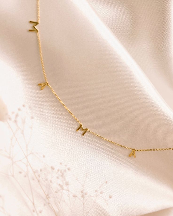 Add a personal touch and cherish the special moments with our Mama Necklace. A dainty letter necklace that can be worn alone or layered with any of our other dainty chain necklaces.Whether you're expecting, already have a little one, or know someone that's going to be, our Mama Necklace is the sweetest gift. Details: -Gold Filled, Sterling Silver -16" + 2" extender -Hypoallergenic, Tarnish Free, Waterproof Dainty Everyday Name Charm Necklace, Dainty Adjustable Name Necklace, Dainty Name Charm Necklace For Everyday, Delicate Everyday Custom Name Necklaces, Delicate Custom Name Necklaces For Everyday, Mother's Day Initial Pendant Name Necklace, Delicate Everyday Name Necklace, Delicate Initial Necklace Gift, Delicate Initials Name Necklace For Everyday