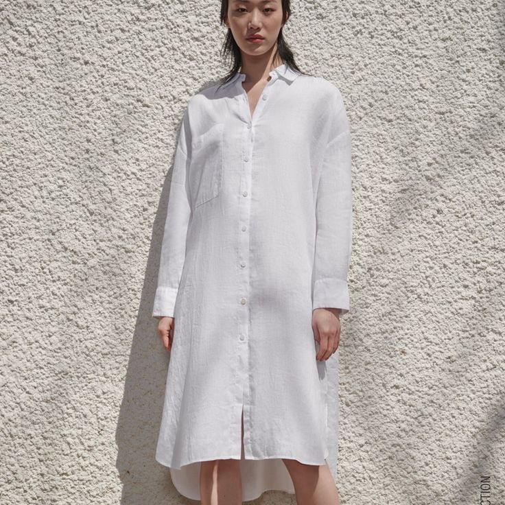 Full Cut Shirt Made Of 100% Linen. Lapel Collar And Long Cuffed Sleeves. Front Patch Pocket. Back Pleat Detail. Asymmetric Hem With Side Vents. Front Button Closure. Oversized White Blouse With Placket, White Oversized Casual Shirt Dress, Oversized White Shirt Dress For Spring, Casual White Oversized Shirt Dress, Oversized Casual Blouse With Curved Hem, Oversized Shirt With Spread Collar For Spring, Spring Daywear Shirt With Shirttail Hem, Spring Shirttail Hem Shirt For Daywear, Oversized Spring Shirt With Placket