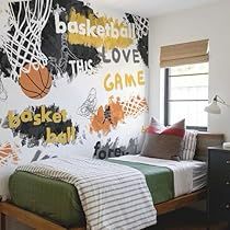 a bed room with a neatly made bed and a basketball mural on the wall