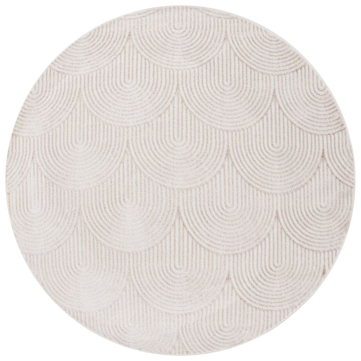 a round rug with white circles on the top and bottom, in an oval pattern