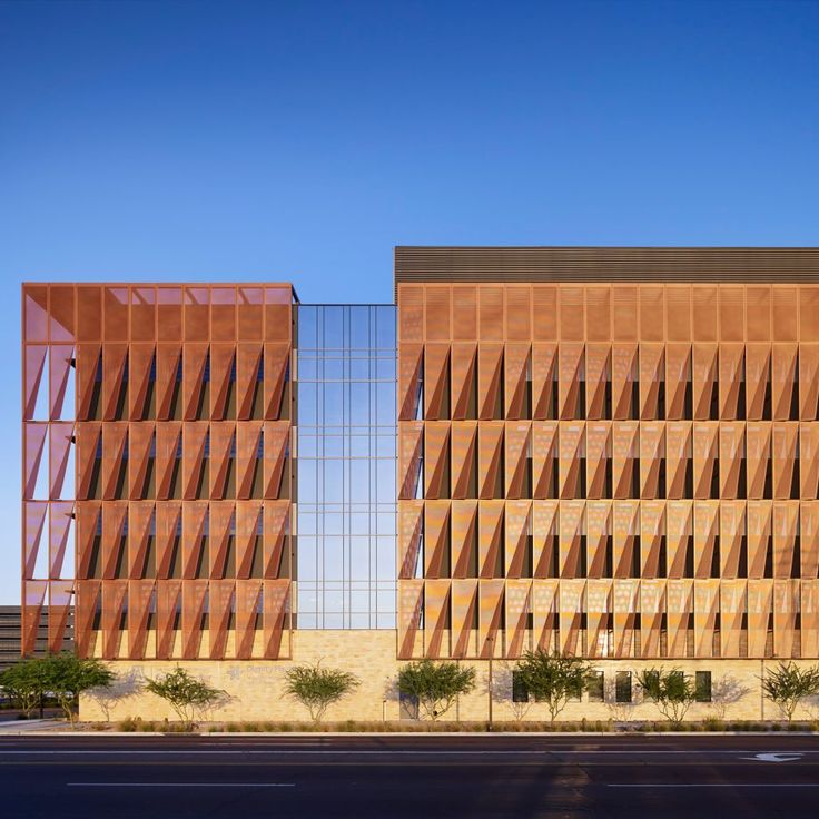 two large brown buildings sitting next to each other