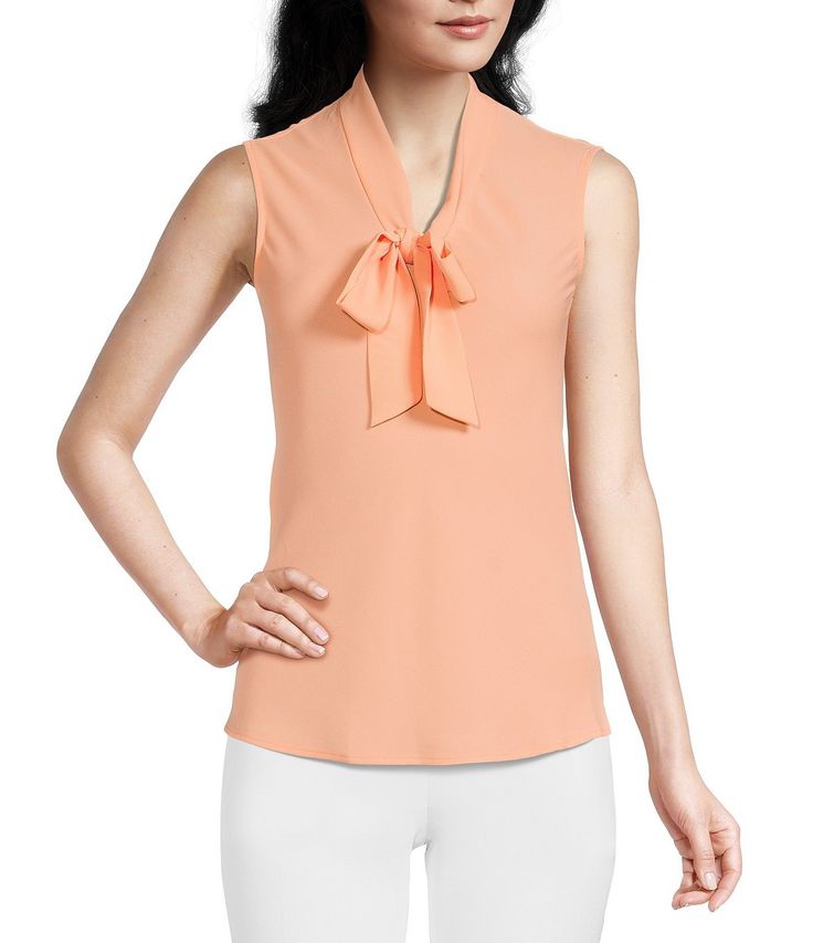 From Kasper, this blouse features:V-neckline with tie front sashSleevelessStraight hemlinePullover constructionPolyesterDry cleanImported. Elegant V-neck Top With Bow, Elegant Sleeveless Tops With Tie Waist, Chic Sleeveless Top With Tie Waist, Sleeveless Tie Waist Top For Spring, Spring Sleeveless Top With Tie Waist, Sleeveless Tops With Tie Waist For Spring, Spring V-neck Top With Bow Detail, Spring V-neck Top With Bow, V-neck Top With Bow For Spring