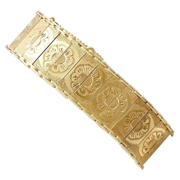 An impressive vintage 1960s 9 karat yellow gold bracelet; part of our diverse vintage jewelry and estate jewelry collections. This fine and impressive vintage bracelet has been crafted in 9k yellow gold. The fully articulated bracelet is composed of twenty-eight rectangular links, embellished with a hand engraved floral design. The reverse of each individual link is hallmarked with the 9k gold fineness mark (9.375). The bracelet secures with a discreet integrated push fit clasp and benefits from Vintage Diamond Bracelet, Retro Bracelet, Gold Link Bracelet, Antique Bracelets, Wide Bracelet, Diamonds And Gold, Yellow Gold Bracelet, Coat Women, Vintage Bracelets