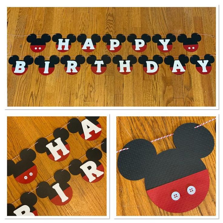 a mickey mouse birthday banner and decorations on a wooden floor with the words happy birthday