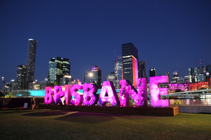 a large sign that is lit up in the shape of an urban city at night