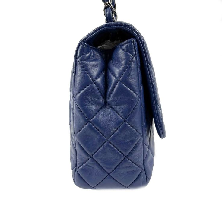 CHANEL - Classic Single Flap Bag - Blue Quilted Lambskin Maxi Shoulder Bag Description * This stylish 2008 Chanel shoulder bag is crafted of soft and smooth diamond quilted lambskin leather in royal blue. The bag features a silver chain-link shoulder strap threaded with leather and a front flap with a silver Chanel interlocking CC logo turn-lock closure. The shoulder bag opens to a blue leather interior lining with zip and slip pockets, and one exterior pocket. Measurements * Width: 12" in / 30.48 cm * Height: 8" in / 20.32 cm * Depth: 3.25" in / 8.255 cm * Strap Drop: 23" in / 58.42 cm * Handle Drop: 13" in / 33.02 cm Details * Made In: France * Color: Royal Blue, Silver * Material: Lambskin Leather, Silver-Tone Metal Condition * Very Good * Creasing and cracking found on leather, particu France Colors, Chanel Shoulder Bag, Diamond Quilt, Leather Silver, Cc Logo, Silver Material, Fendi Bags, Flap Bag, Leather Interior