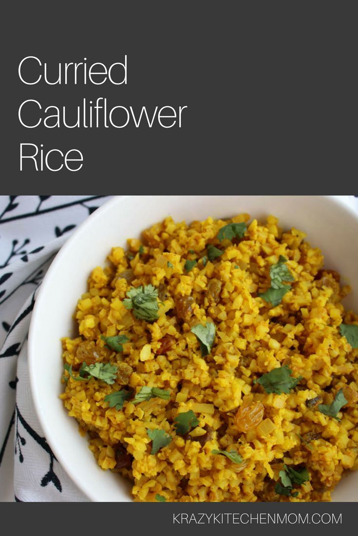 a white bowl filled with rice and topped with cilantro