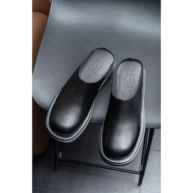 The Veltrique Nuptial Luxeform Loafers are brogue slippers crafted with a cow leather upper and a genuine pigskin lining, featuring a round toe design and a slip-on closure. They have a rubber outsole and a full grain leather insole, with a heel height of approximately 2.2 inches. Beach Slippers, Footwear Collection, Toe Designs, Casual Everyday, Travel Backpack, Full Grain Leather, Signature Style, Color Trends, Cow Leather