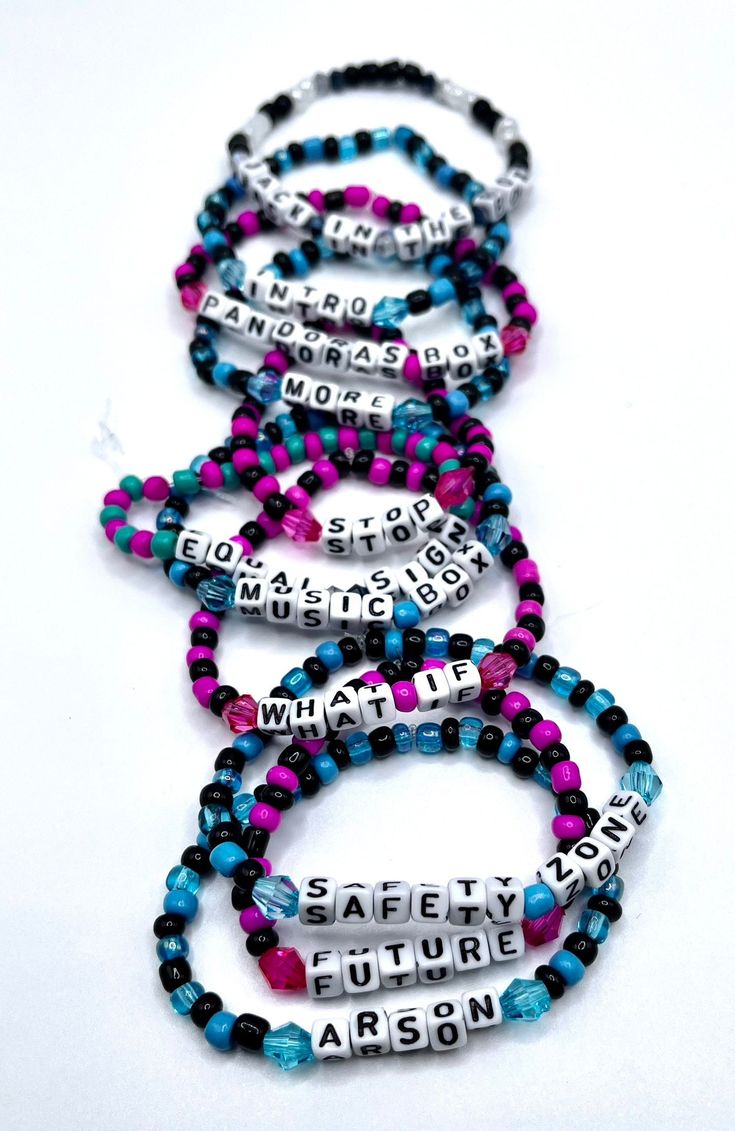 four bracelets with words on them