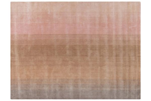 an area rug with different shades of pink, brown and beige on the bottom half