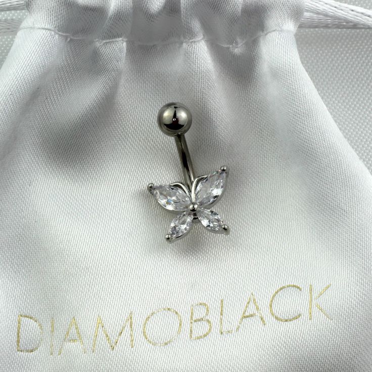 a close up of a ring with a butterfly on it's side and the word diamondblack written in gold