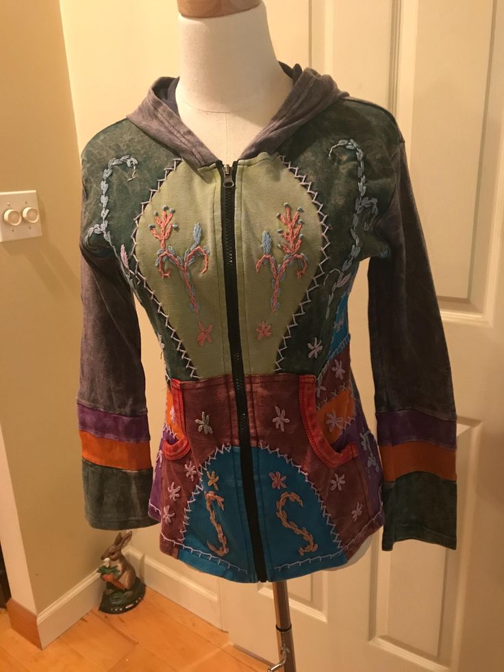 Very cool hoodie with patchwork and embroidery design long sleeve with full zip, this is an awesome hoodie in excellent condition on all accounts. Tag is too faded to see size,Im saying Small to Med, measurements shown in pics, all cotton, very soft.  price includes shipping. Multicolor Long Sleeve Hoodie With Drawstring, Cotton Patchwork Hoodie, Casual Patchwork Hooded Jacket, Casual Hooded Jacket With Patchwork, Casual Hooded Jacket With Patchwork And Long Sleeves, Multicolor Long Sleeve Hooded Jacket With Pockets, Fall Patchwork Hoodie Jacket, Casual Long Sleeve Hooded Jacket With Patchwork, Fall Hooded Patchwork Jacket