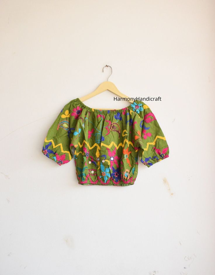 HarmonyHandicraftCo represent you a beautiful Banjara Top. Make your look more stylish by wearing this Banjara top.  Hand embroidery top with inside lining fabric. Banjara Top, Hand Embroidery Top, Indian Style Top, Indian Handmade Top, Banjara Kuchi Top, Hand Embroidery Choli, Banjara Choli. MEASUREMENTS :  Length - 17.5 Inches Chest - 42 Inches Inside lining Fabric FABRIC 100 % Hand Embroidered Could be used for Party, Birthday , Vacations Etc. Selling it at unbeatable price!! Wash Care - Mach Multicolor Floral Embroidered Top For Navratri, Navratri Floral Embroidered Multicolor Top, Navratri Multicolor Floral Embroidered Top, Floral Embroidered Top For Navratri, Bohemian Chikankari Embroidered Top For Festive Occasions, Bohemian Choli With Floral Embroidery For Festivals, Bohemian Green Choli With Resham Embroidery, Bohemian Resham Embroidered Top For Festive Occasions, Festive Bohemian Top With Resham Embroidery