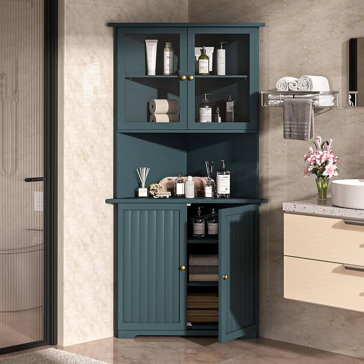 a bathroom with a blue cabinet next to a sink