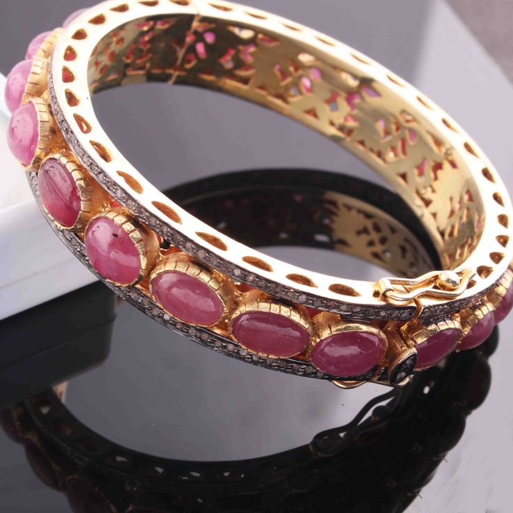 One (1) Pc Beautiful Pave Diamond With Ruby Bangle Bracelet- 925 Sterling Vermeil - Bangle With Lock - Bangle Bracelet BD047 Approx Measurement : Bangles Size: 2.25 inches inside diameter Silver Purity: 925 Metal: Sterling Silver Finish: Vermeil Stone: Ruby, 13mm Sold As: 1 Pc We are continuously adding new products in our store. So keep coming back to see more great deals on gems in our mart. Amazing quality at the best price around!!! Bulk wholesale orders are welcome on this item and any othe