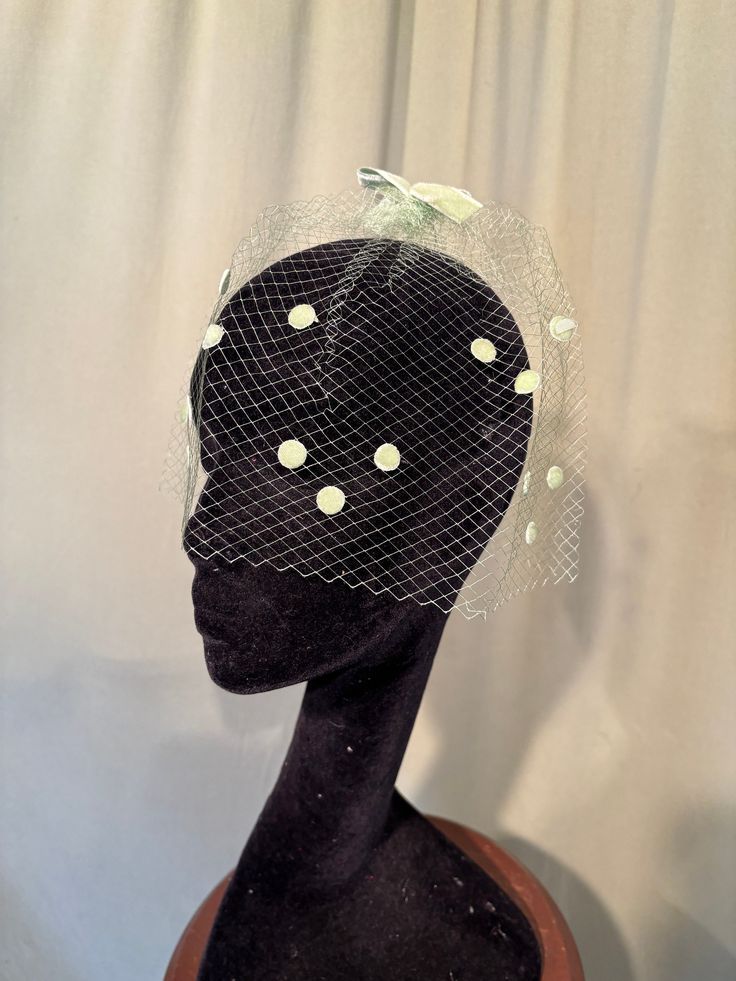 This is a charming, vintage veil with velvet bows & velvet dots. It is not labeled. It is a "One size fits all", designed to attach to your hair.   It is a single veil of mesh, chartreuse green netting. It is trimmed with small chartreuse green velvet bows on the top & back.  The netting is trimmed with little velvet dots on the sides & front. It is in good, vintage condition. The netting shows a few small breaks, please see photos.  No wear or tear. No soil or stains.   Charming! Vintage Mini Hat Headband For Vintage Events, Vintage Headband For Kentucky Derby, Vintage Spring Headband, Vintage Fitted Headband For Vintage Events, Vintage Kentucky Derby Mini Hat Headband, Vintage Headband For Church, Vintage Headband Fascinator For Church, Vintage Fascinator Headband For Church, Vintage Church Fascinator Headband