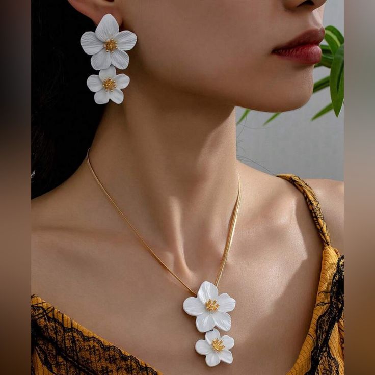 White Flower Earrings And Necklace Set Material: Zinc Alloy, 14k Gold Plated Size: See Photo For Measurements Jeweled Flowers, White Flower Earrings, Free People Necklace, Crystal Locket, White Flower Earring, 10k Gold Chain, Earrings And Necklace Set, Christian Necklace, Sunflower Necklace