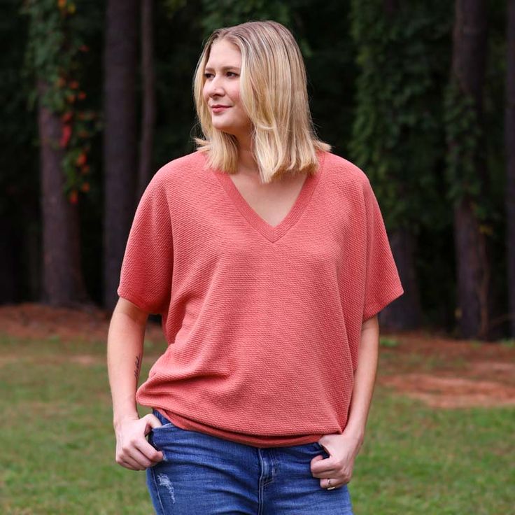 Introducing our chic and contemporary women's fashion top, where style meets comfort effortlessly. The cocoon sleeves add a modern twist, offering a relaxed yet flattering silhouette that drapes beautifully. Whether you're heading to a brunch date or a casual evening out, this versatile piece effortlessly transitions from day to night. Pair it with your favorite jeans for a laid-back vibe, or dress it up for a polished look. Make Your Outfit, Fall Faves, Southern Women, Brunch Date, Casual Evening, Fashion Top, Oversized Tee, Short Rompers, Dress Romper