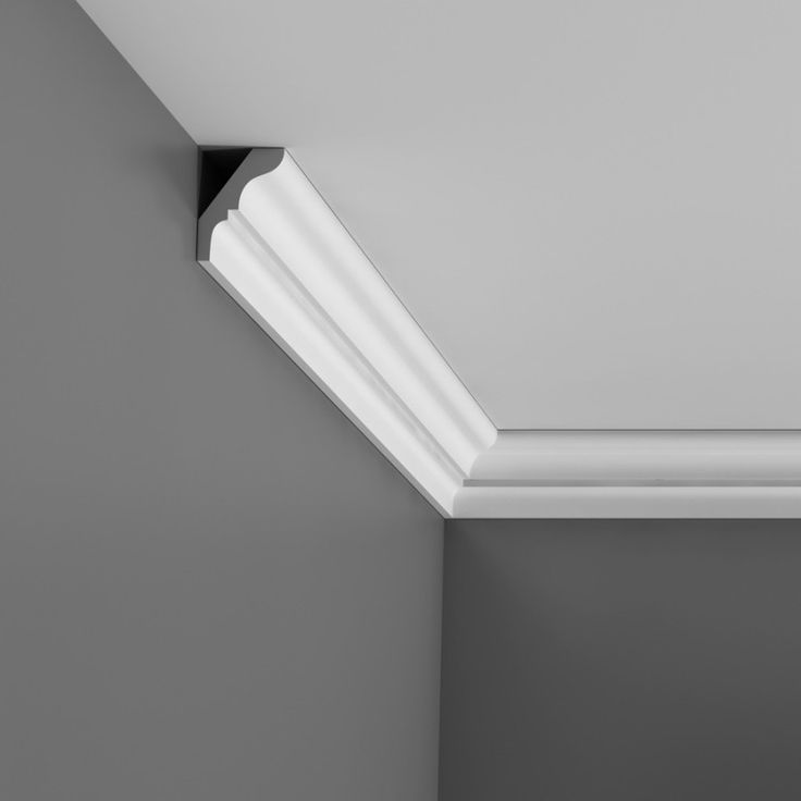 a black and white photo of the corner of a ceiling