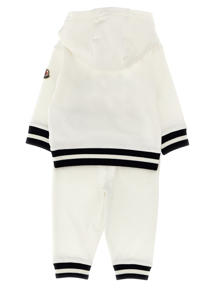 Cotton hoodie & joggers jumpsuit with front terry cloth logo and contrast cuffs. Composition: 95% cotton 5% elastane White Sweats With Ribbed Cuffs For Jogging, Cotton Athleisure Tracksuit With Ribbed Cuffs, White Cotton Tracksuit For Jogging, Cotton Sportswear Tracksuit With Ribbed Cuffs, Jogging Tracksuit With Ribbed Cuffs And Hoodie, Sporty Tracksuit With Hoodie And Ribbed Cuffs, Cotton Tracksuit With Ribbed Cuffs And Hoodie, Sporty Cotton Tracksuit With Drawstring Hood, Sporty Hoodie With Logo Detail For Loungewear