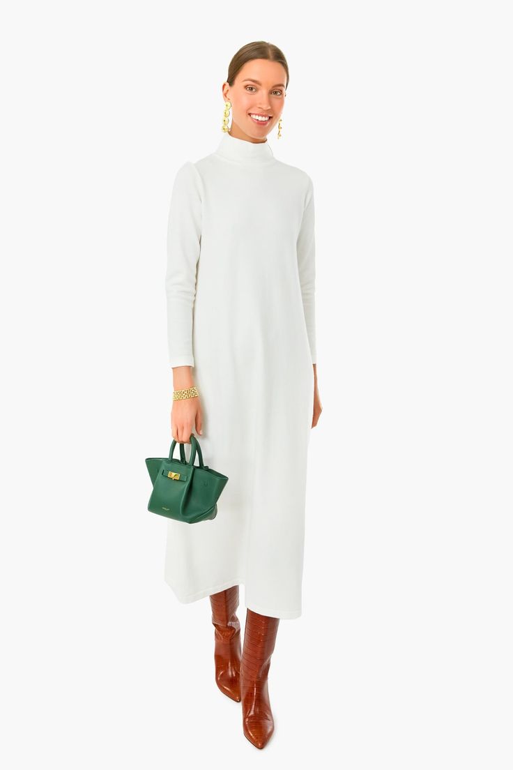 Winter whites anyone? Chic understated glamour meets the Pearled Ivory Ellery Dress. With a turtleneck, three-quarter length sleeves, and an A-line fit, this maxi is the epitome of elegance and class. Whether youâre window shopping or heading to your favorite restaurant with friends, pair this sweet, sweater stunner with gold accessories and a tote bag that pops for a timeless look. Turtleneck Three-quarter length sleeves A-line silhouette Maxi length Sweater dress style Material: 48% Viscose, White Maxi Dress For Evening In Winter, White Maxi Dress For Winter Evening, White Turtleneck Dress For Fall, Elegant White Turtleneck Dress, Elegant White High Neck Maxi Dress, White High Neck Midi Dress For Fall, Elegant 3/4 Sleeve Maxi Dress For Fall, White High Neck Maxi Dress For Spring, Chic White High Neck Midi Dress