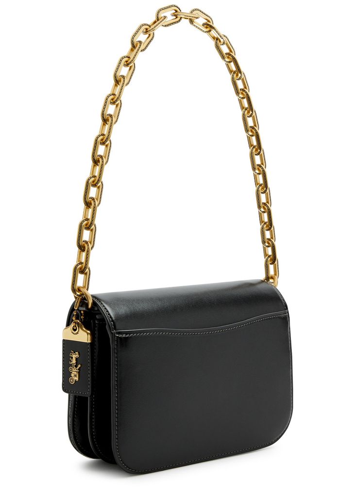 Find COACH Idol Leather Shoulder Bag on Editorialist. The Coach Idol Leather Shoulder Bag features a detachable chain shoulder strap, a detachable adjustable leather shoulder strap, a designer plaque, and a detachable hanging designer tag on the side. It includes a back slip pocket, two compartments, a concealed press-stud fastening pocket at the front flap, an internal zip-fastening pocket, and a fully lined interior. It features a concealed magnetic fastening at the front flap. The bag measures 8 inches in width, 6 inches in height, and 2.5 inches in depth. The chain shoulder strap has a drop of 9.5 inches. The leather shoulder strap has a minimum drop of 19.5 inches and a maximum drop of 23.5 inches. Coach Rectangular Shoulder Bag With Chain Strap, Coach Leather Shoulder Bag With Chain Strap, Luxury Coach Shoulder Bag With Chain Strap, Coach Black Bag With Detachable Handle, Coach Black Shoulder Bag For On-the-go, Coach Leather, Press Studs, Leather Shoulder Bag, 6 Inches