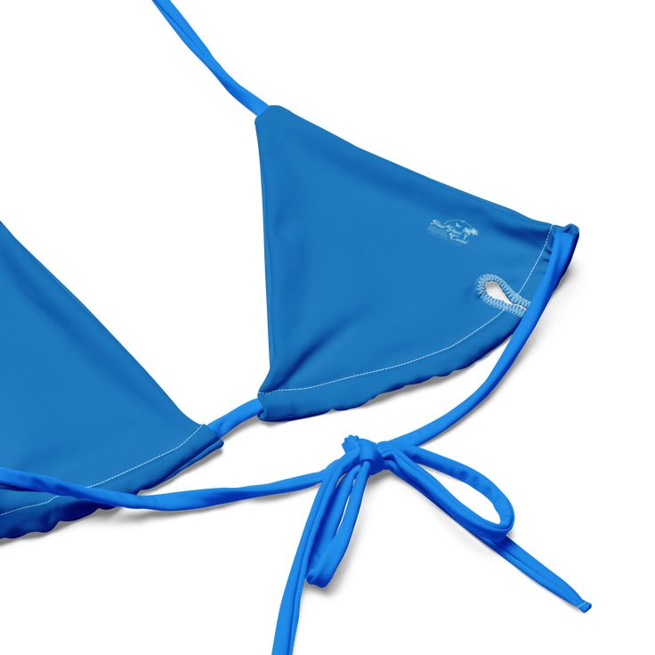 Stay comfortable and beach ready all summer in this FYC String Bikini set. It’s made from soft recycled polyester with double-layering and UPF 50+. Style the straps how you like, and get ready to swim! • Soft and stretchy material with UPF 50+ • Sizes up to 4XL • Bikini top comes with removable padding for comfort • Multiple ways to tie and style the bikini set Disclaimer: To make your All-Over Print Recycled String Bikini last longer, thoroughly rinse it off after each use and get rid of any ch Adjustable Summer Swimwear With Uv Protection, Adjustable Uv Protection Summer Swimwear, Nylon Triangle Top Swimwear For Beach Season, Summer Beach Swimwear With Built-in Cups, Summer Triangle Top Swimwear In Nylon, Adjustable Straps Beachwear Swimwear, Solid Color Swimwear With Upf 50+ For Water Sports, Bra-friendly Summer Nylon Swimwear, Uv Protection Swimwear With Tie-side Bottom