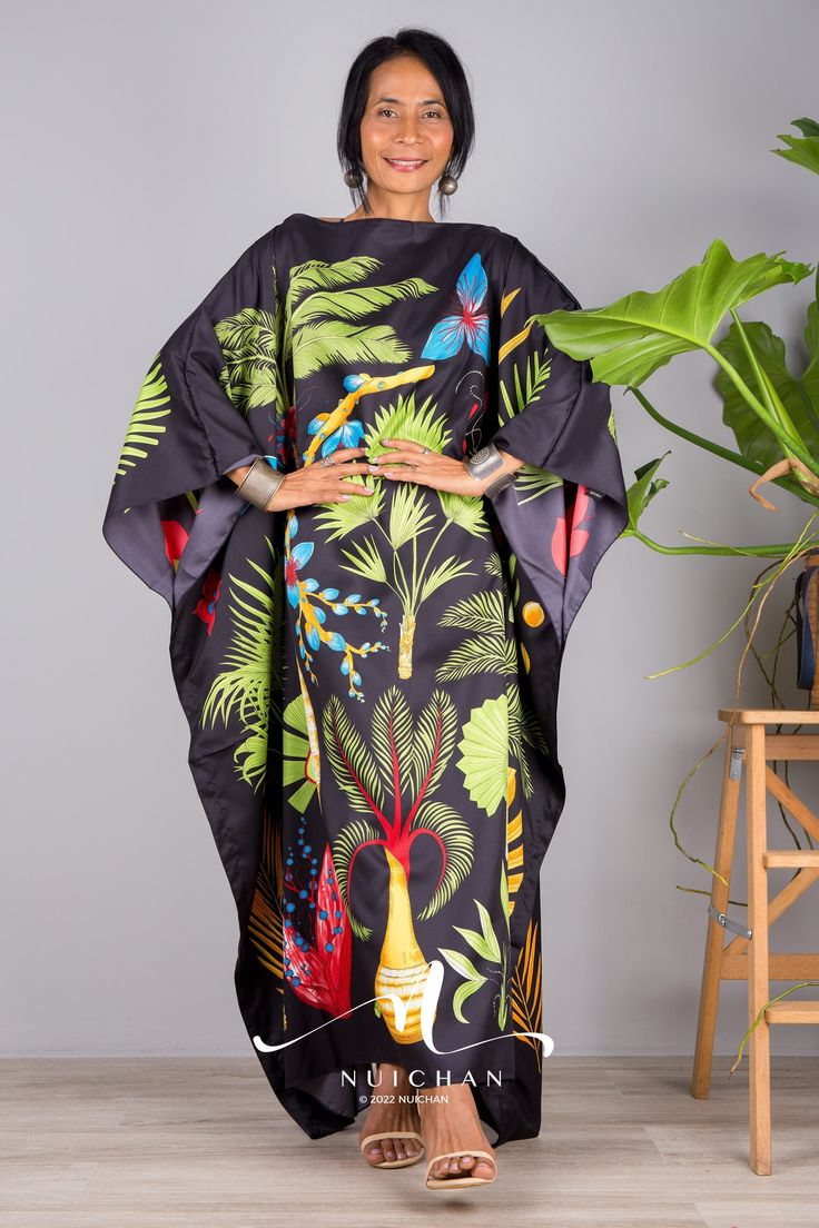 "Stunning Silk Satin kaftan dress. This tropical floral kaftan resort dress is also suitable for plus size ladies. A bohemian caftan maxi dress with floral print. Could also be used as a sleepwear night gown PRODUCT SIZE : One Size Fits Most up to size US 3XL These are the exact measurements from the dress, measured whilst laying flat >> * Chest : up to 54\" * Waist : 54\" * Hips : 54\" * Sleeve length from neckline to hem : 18\" * Length : 50\" NOTE : * Model chest : 32\", waist : 24\" hips : 3 Black Silk Maxi Dress For Vacation, Elegant Black Kaftan With Floral Print, Black Floral Print Maxi Kaftan, Black Silk Kaftan With Kimono Sleeves, Black Long Silk Kaftan, Long Black Silk Kaftan, Black Silk Maxi Kaftan, Green Digital Print Kaftan, Black Silk Maxi Length Kaftan