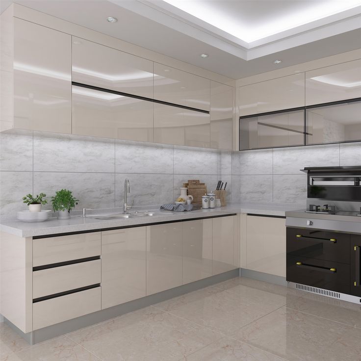 a modern kitchen with white cabinets and marble counter tops