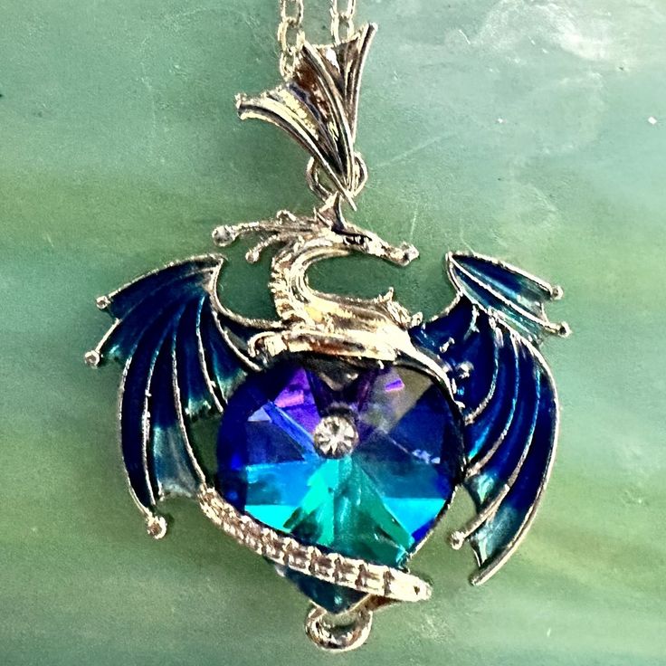 Thanks For Stopping By! While You're Here Please Take A Look At The Other Items In My Shop. Bundle And Save! About This Item: Dragon Pendant With Blue/ Teal / Violet Heart On Silver Tone Adjustable 18-20" Chain Thank You For Looking! Condition: New With Tags Personalized Blue Necklaces For Valentine's Day, Blue Personalized Necklace For Valentine's Day, Personalized Blue Necklace For Valentine's Day, Blue Personalized Metal Jewelry, Personalized Blue Jewelry, Personalized Blue Heart Pendant Jewelry, Blue Personalized Heart Pendant Necklace, Personalized Blue Metal Jewelry, Personalized Blue Heart Pendant Necklace