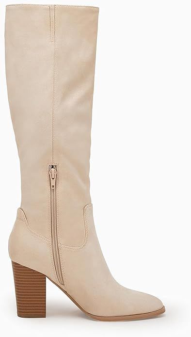 These Wide Calf Square Heel Knee High Boots feature a wide calf design that accommodates calves up to 18in and a square heel for stylish comfort. Enjoy the timeless look of knee high boots with the added benefit of a generous fit. Imported Rubber sole Shaft measures approximately Knee High from arch Beige Wide Calf Knee-high Heeled Boots, Beige Knee-high Heeled Boots With Wide Calf, Beige Knee-high Heeled Boots For Wide Calves, Chic Beige Wide Calf Knee-high Boots, Chic Beige Knee-high Heeled Boots, Beige Wide Calf Boots With Block Heel, Wide Calf Mid-calf Boots With Reinforced Heel, Beige Wide Calf Knee-high Boots, Beige Wide Calf Pointed Toe Heeled Boots