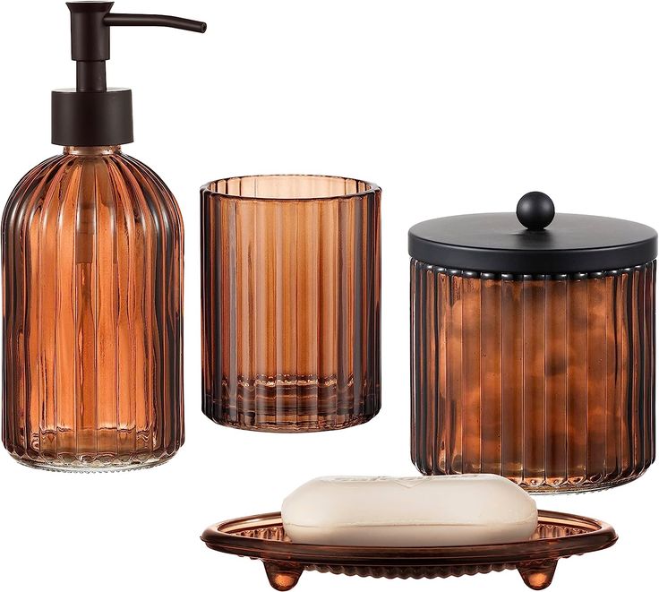 an assortment of bathroom accessories including soap dispenser