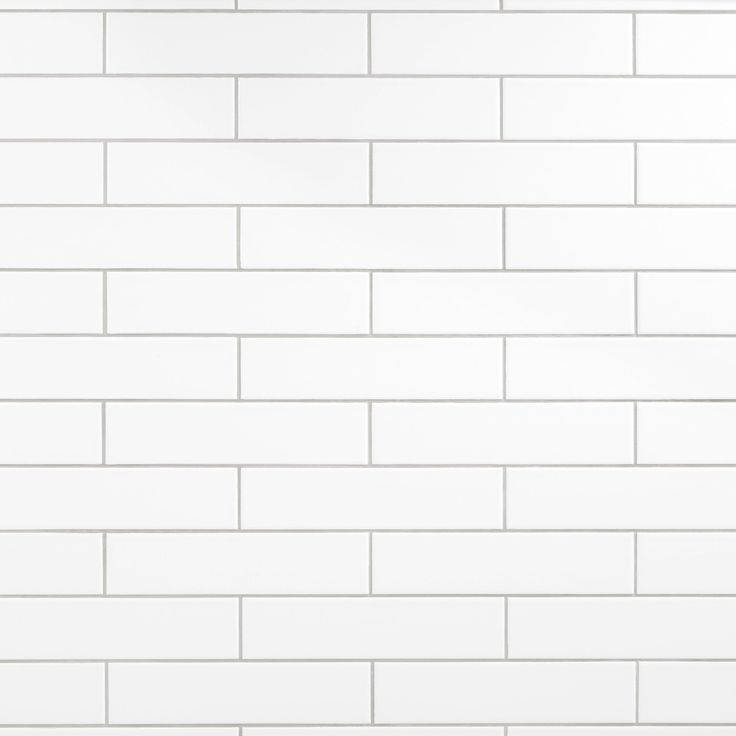 a white tiled wall with no one in it