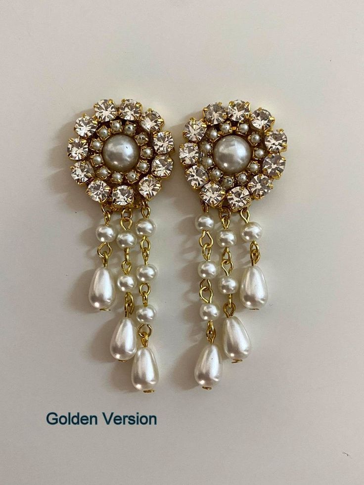 "A gorgeous shiny drop pearls earrings features Elegance and style: A beautiful chandelier earrings made of silver sterling filigree set with Swarovski rhinestone and vintage pearls, tiny ivory white pearls and teardrop pearls in three different height of rows. The back of the earring is ear pierced. They are available in clip-on. Beautiful delicate bridal earrings features rhinestone and ivory pearls, a vintage Hollywood style design, very comfortable for the bride or the bridesmaids. Dainty ea Luxury Temple Jewelry Style Bridal Earrings, Luxury Pearl Drop Chandbali Bridal Earrings, Luxury Bridal Chandbali Earrings With Pearl Drop, Elegant Pearl Chandelier Dangle Earrings, Elegant White Bling Earrings, Elegant Pearl Dangle Chandelier Earrings, Pearl White Dangle Chandelier Earrings With Pearl Drop, Jeweled Dangle Bridal Earrings, Pearl Charm Dangle Chandelier Earrings For Party