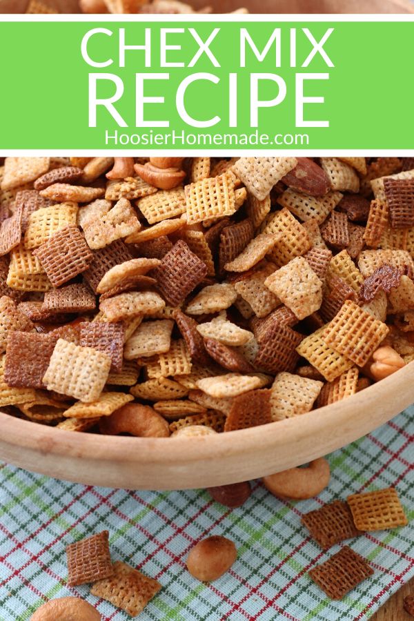 homemade chex mix recipe in a wooden bowl on top of a checkered cloth