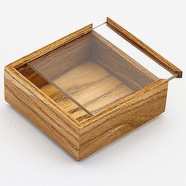 a small wooden box with a glass lid