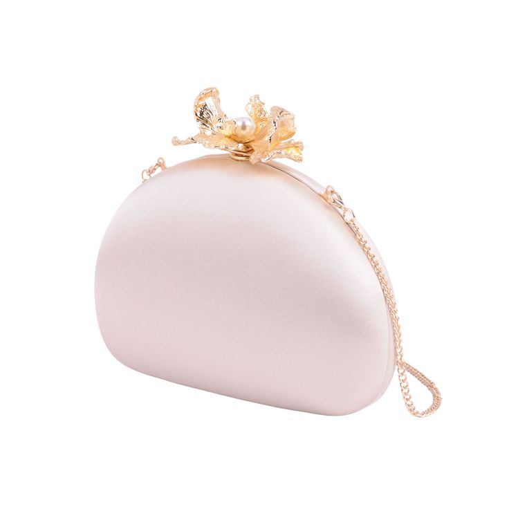 Embrace the epitome of elegance with our Silk Round Clutch, adorned with intricate flower hardware and a chic chain crossbody strap. This sophisticated accessory captures the essence of refined femininity, as the smooth silk exudes luxury and the detailed floral hardware adds a touch of romance. The versatile chain strap ensures effortless carrying, making it an ideal companion for any occasion. Elevate your style and make a statement with this beautifully crafted clutch, where the delicate allure of silk meets the timeless charm of floral design. Luxury Elegant Clutch Wallet On Chain, Elegant Rose Gold Evening Bag For Events, Rose Gold Glamorous Clutch For Formal Occasions, Elegant Spring Evening Bag With Detachable Strap, Elegant Rose Gold Evening Bag, Formal Flower-shaped Evening Bag, Elegant Clutch With Gold-tone Hardware, Elegant Evening Bag With Gold-tone Hardware, Elegant Evening Bag With Gold-tone Hardware For Formal Events