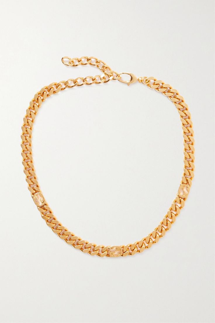 Gucci's necklace has been made in Italy from gold-tone metal and scattered with interlocking 'G' motifs. The gourmette chain is textured on the side and first appeared in the house's '21 'Aria' collection. Wear yours with a crisp white shirt. Yellow Gold Chain Link Jewelry With Gold-tone Logo, Gold-tone Metal Necklace With Logo Plaque, Gold Chain Necklace With Gold-tone Logo, Gold Chain Necklace With Logo Plaque, Gold Metal Necklaces With Gold-tone Logo Plaque, Elegant Gold-tone Chain Link Jewelry With Logo Plaque, Elegant Gold-tone Chain Link Jewelry, Formal Gold-tone Necklace With Logo Plaque, Luxury Metal Necklaces With Gold-tone Logo Plaque