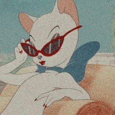 an animated cat wearing sunglasses and sitting on the beach