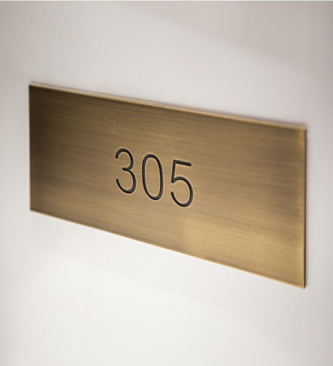 a metal plaque with the number 350 on it