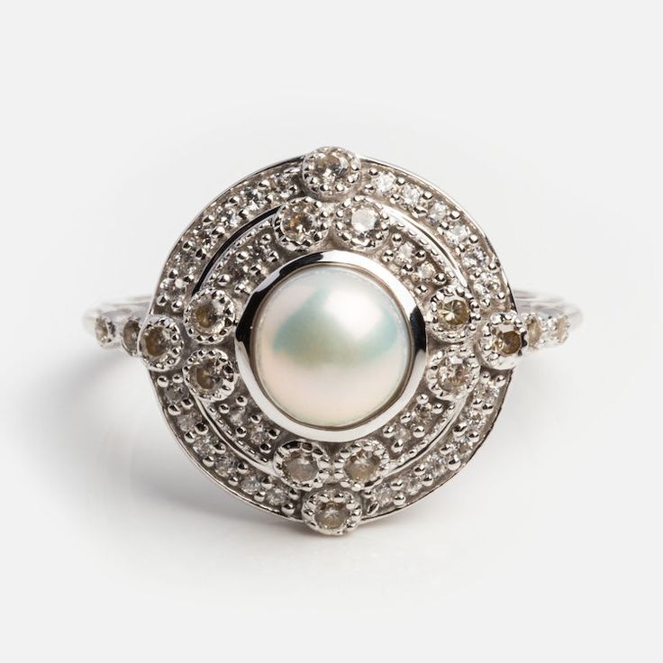 Celestial Pearl Vintage Ring | Local Eclectic Classic White Cluster Ring Hallmarked, Classic White Hallmarked Cluster Ring, Classic White Pearl Ring With Diamond Accents, Classic Brilliant Cut Diamond White Pearl Ring, Timeless Diamond White Brilliant Cut Pearl Ring, Timeless Diamond Pearl Ring With Center Stone, Classic White Gold Pearl Ring With Diamond Accents, Timeless White Gold Pearl Ring With Center Stone, Timeless Diamond White Pearl Ring With Brilliant Cut