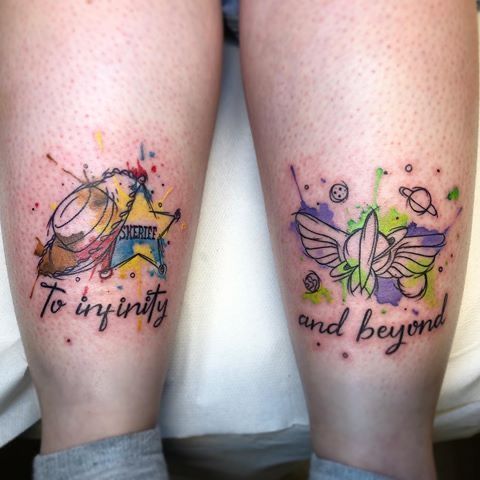 two people with tattoos on their legs that say, to infinnity and beyond