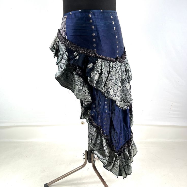 Luna Steampunk Over Skirt, Bustle skirt, tribal mini skirt, fashioned from vintage silk brocade.  This tail skirt is a great addition to all sorts of outfits.  Easily add an extra, colourful layer over leggings, tights, skirts or shorts. Wear at the back or side. The skirt is adjustable in fitting. It has 2 silk ties which are attached to two strong brass hoops for added style and functionality. Strong stitching, pleating and layers of ruched fabric on the tail makes this an eternally stunning p Steampunk Tiered Skirt For Cosplay, Fitted Punk Style Skirt For Costume Party, Bohemian Skirt For Cosplay, Punk Party Skirt With Ruffles, Gothic Mini Skirt For Alternative Fashion, Fitted Gothic Mini Skirt, Fitted Punk Skirt For Alternative Fashion, Steampunk Tiered Skirt For Costume Party, Gothic Ruffled Mini Skirt For Cosplay