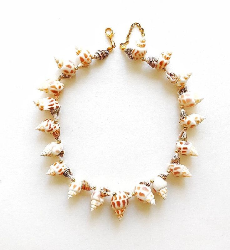 sea shell necklace, white conch necklace, statement necklace, layering necklace, boho shell necklace, sea shell pendant necklace, handmade 'Ariel Necklace') We use the highest quality material in our designs.  All materials except natural stone are 24k gold plated.  Please see the rest of my collection here: https://victoriadesignstoree.etsy.com Cheap Shell Necklace Gift, Cheap Round Shell Necklace For Gift, Cheap Shell Necklaces For Gifts, Cheap Ocean-inspired Shell Necklace For Gift, Cheap Brown Shell Necklace As Gift, Luxury Shell Jewelry For Gifts, Cheap Brown Shell Necklace Gift, Cheap Brown Shell Necklace For Gift, Luxury Shell Necklace With Natural Stones For Gift